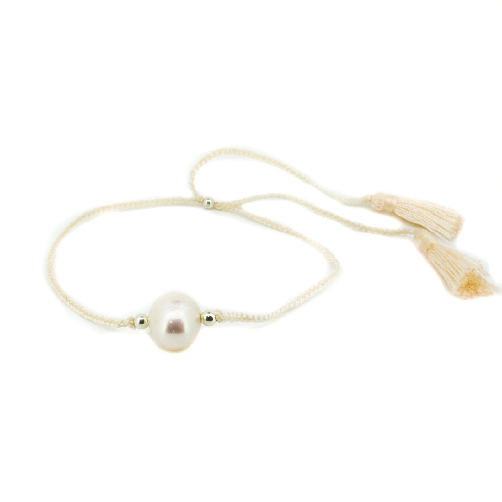 Boho Pearl Cream Tassel Bracelet featuring genuine freshwater pearls and cream tassel detail