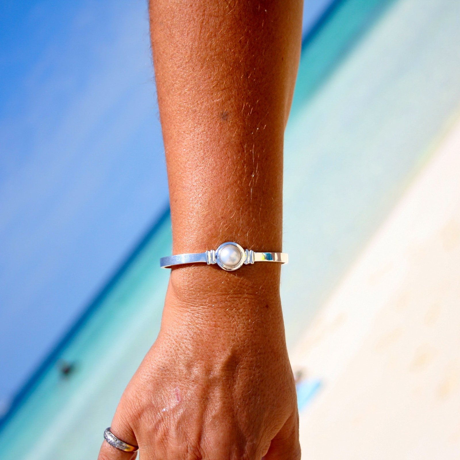 Adjustable sterling silver cuff bangle featuring a 12mm freshwater Mabe pearl, designed in Broome Western Australia with a coastal boho luxe style.