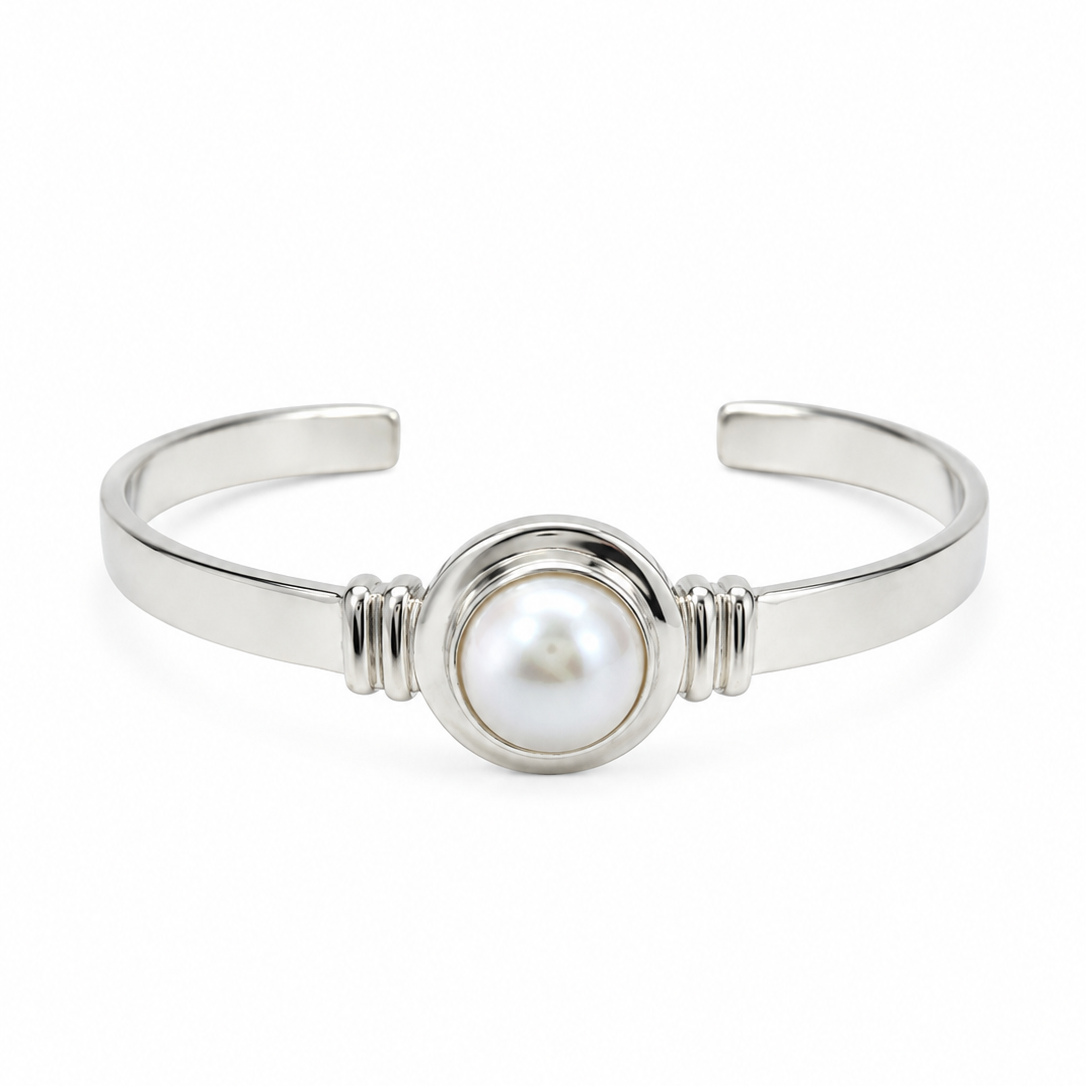 Adjustable sterling silver cuff bangle featuring a 12mm freshwater Mabe pearl, designed in Broome Western Australia with a coastal boho luxe style.