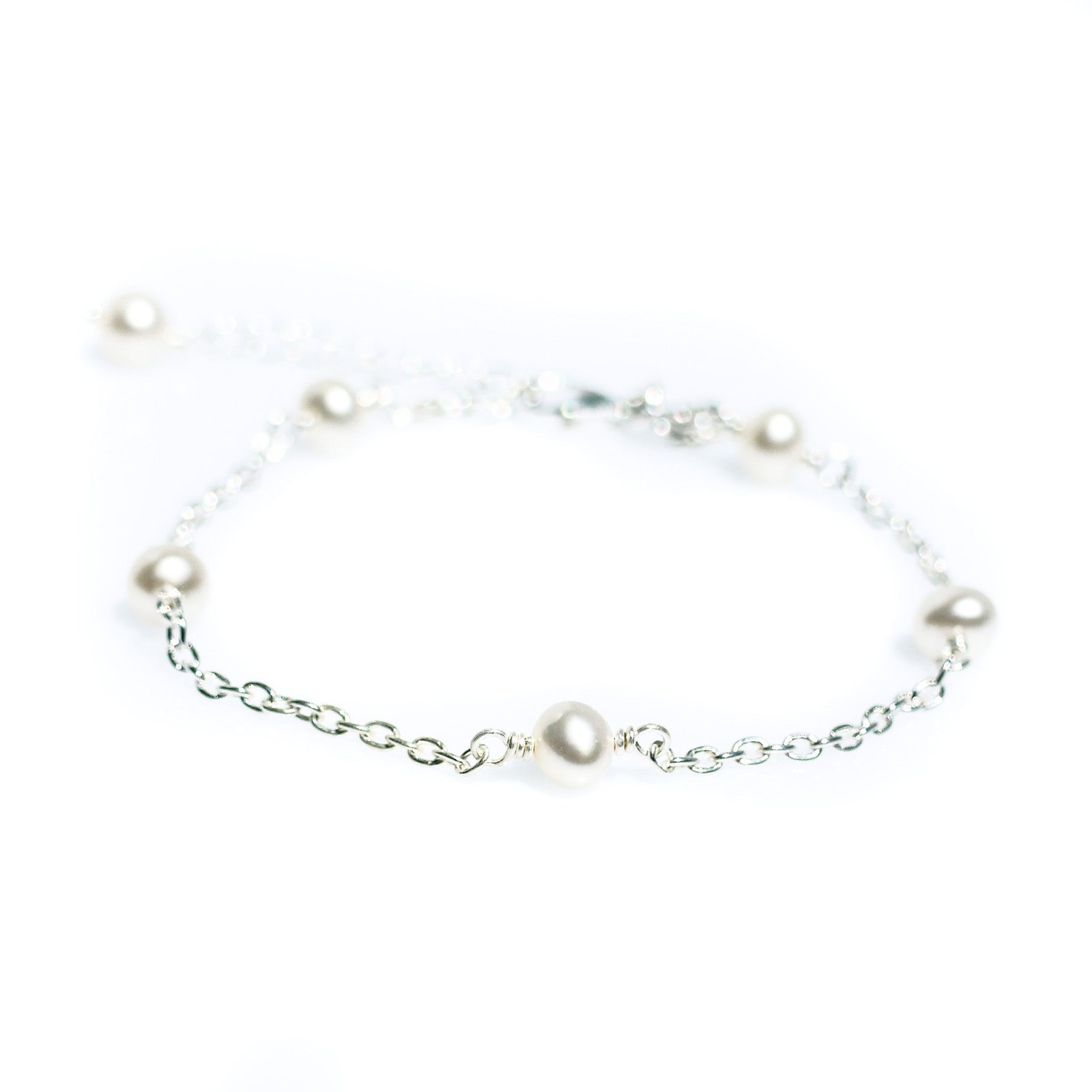 dainty pearl bracelet on silver chain