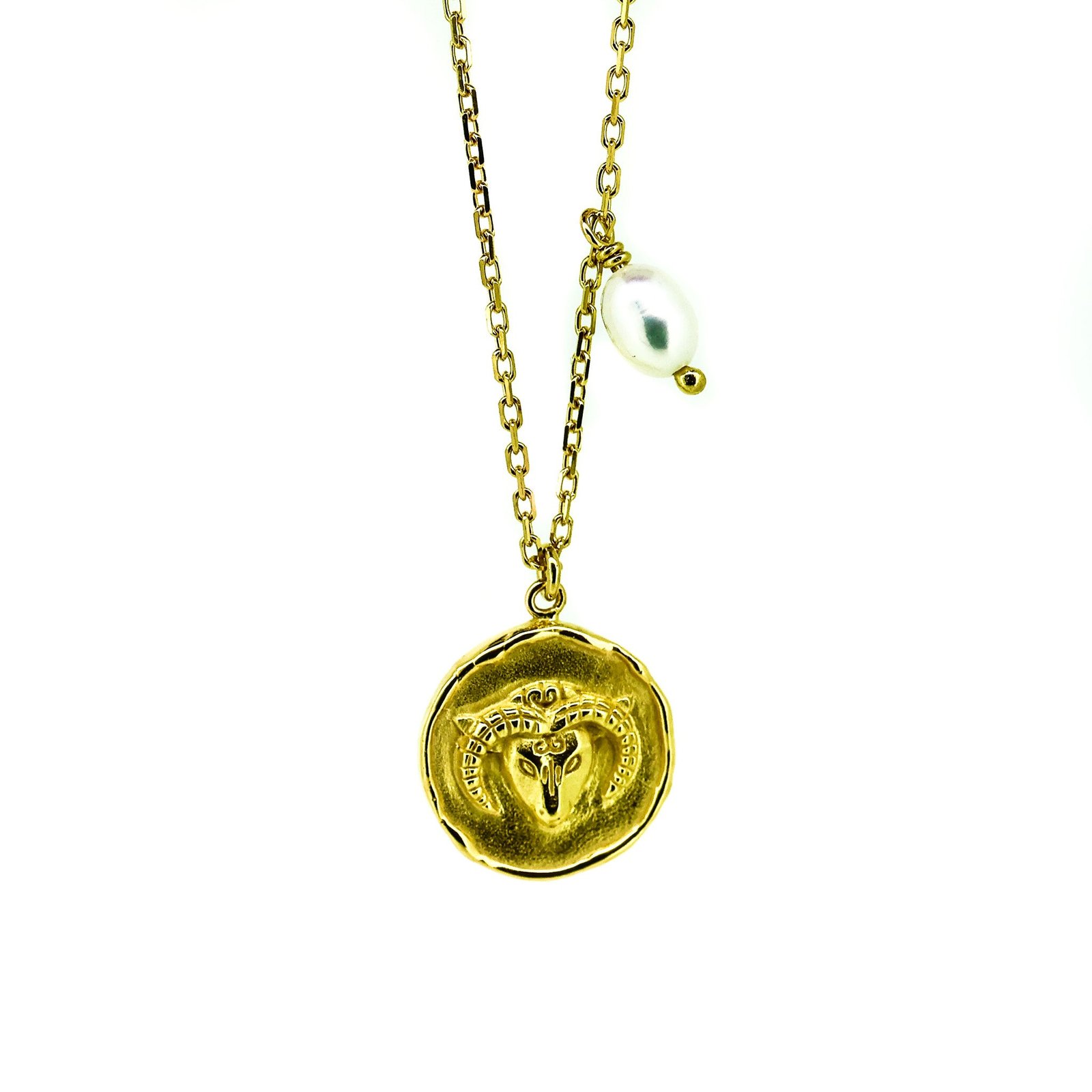 A gold necklace with a round pendant featuring the Aries ram symbol and a lustrous pearl drop at the end.