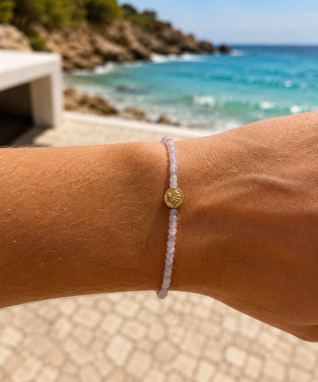 Beach Lavender Love Bracelet crafted with natural faceted kunzite gemstones and gold vermeil shell detail, inspired by the Australian coastline.
