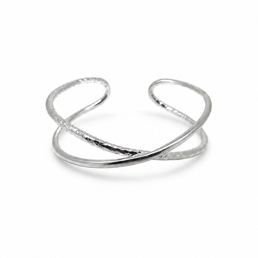 Infinity Sterling Silver Cuff featuring intertwined smooth and textured bands on a white background.